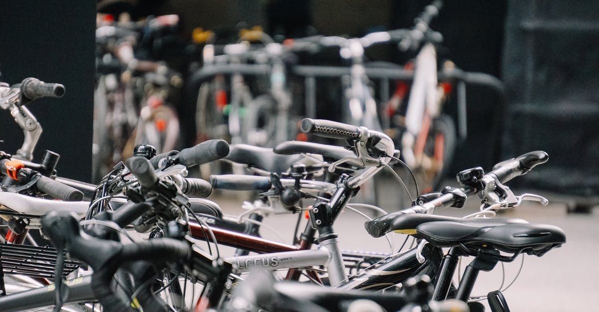 Japan cheapest way to travel? Is carpool/ride share common in Japan? - Bikes in parking space on street Japan cheapest way to travel? Is carpool/ride share common in Japan? - Bikes in parking space on street