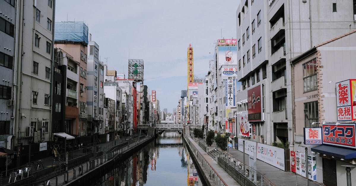 Japan Rail Passes, will I need one? - River Between Concrete Buildings Japan Rail Passes, will I need one? - River Between Concrete Buildings