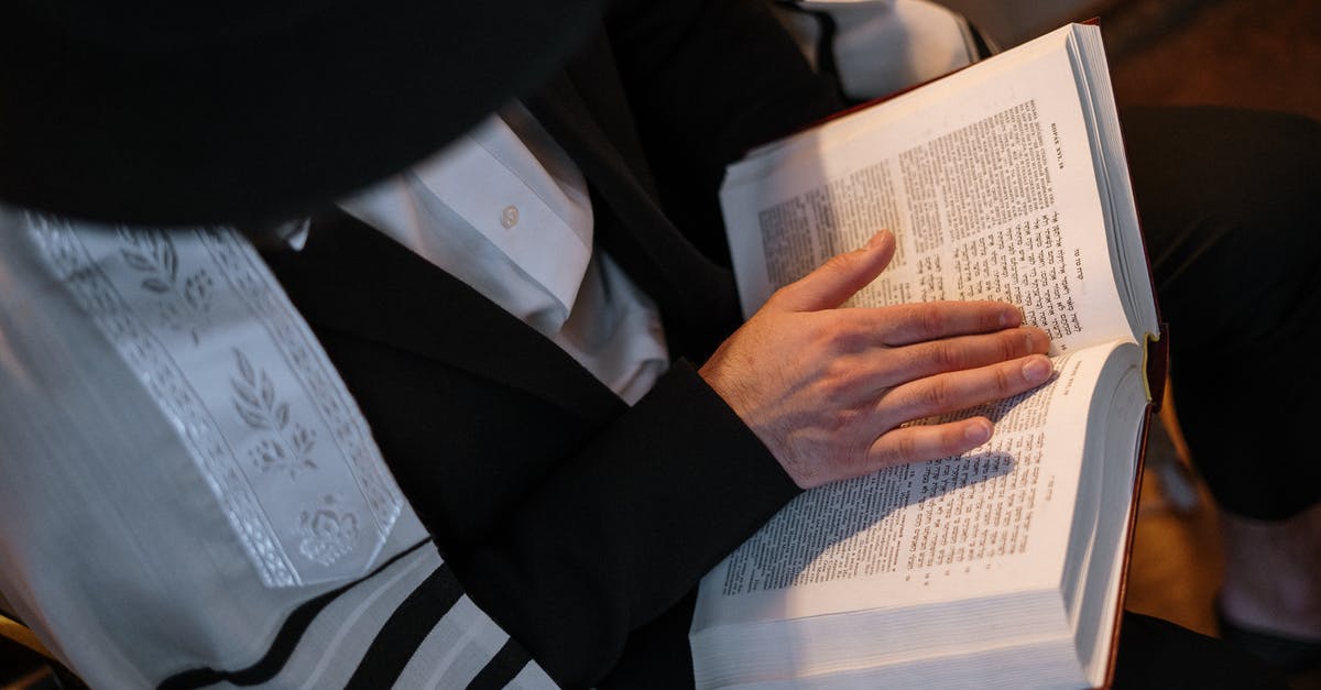 Jewish prayer services in Heathrow Airport - Man Reading Torah Jewish prayer services in Heathrow Airport - Man Reading Torah