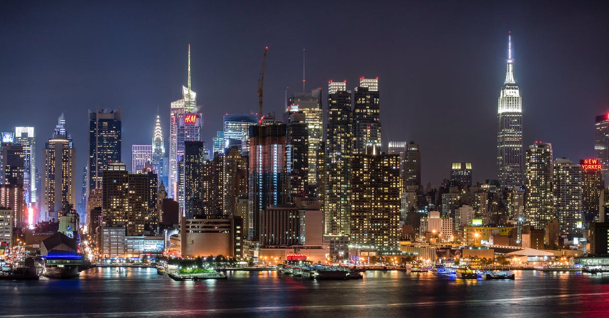 JFK airport to downtown Manhattan at night - City Lights Under Night Sky JFK airport to downtown Manhattan at night - City Lights Under Night Sky