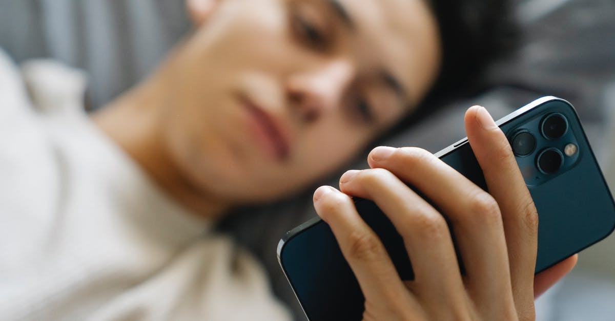 JFK Alaska Lounge time limit with Priority Pass - Soft focus of young guy lying on bed and using modern smartphone in weekend morning at home JFK Alaska Lounge time limit with Priority Pass - Soft focus of young guy lying on bed and using modern smartphone in weekend morning at home