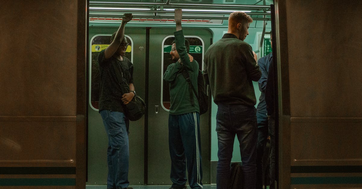 JFK by Public transportation - People in a Gray Train JFK by Public transportation - People in a Gray Train