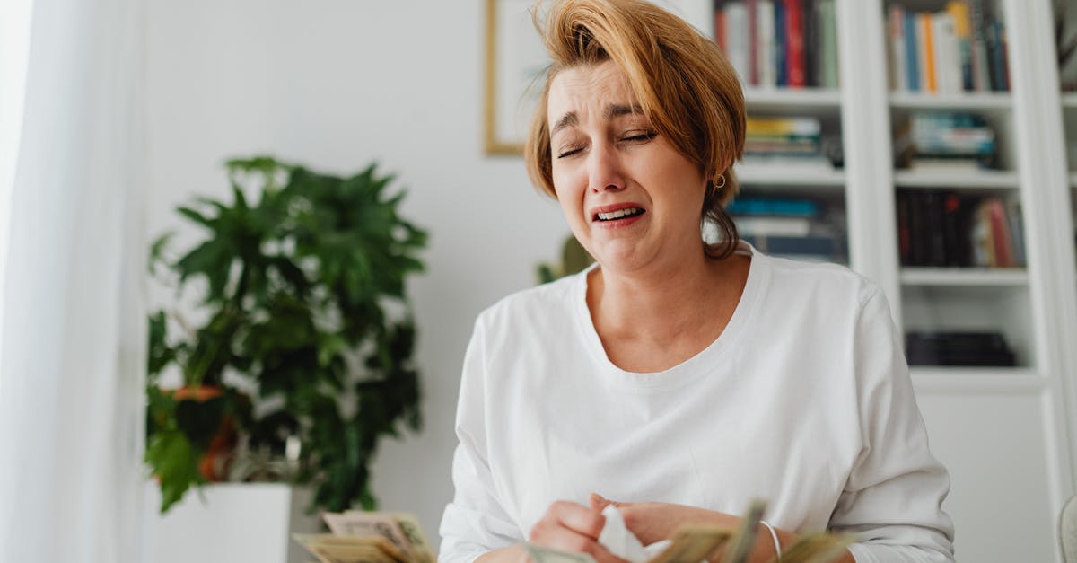 JFK to New Jersey on a student's budget - Woman Counting Money and Crying JFK to New Jersey on a student's budget - Woman Counting Money and Crying