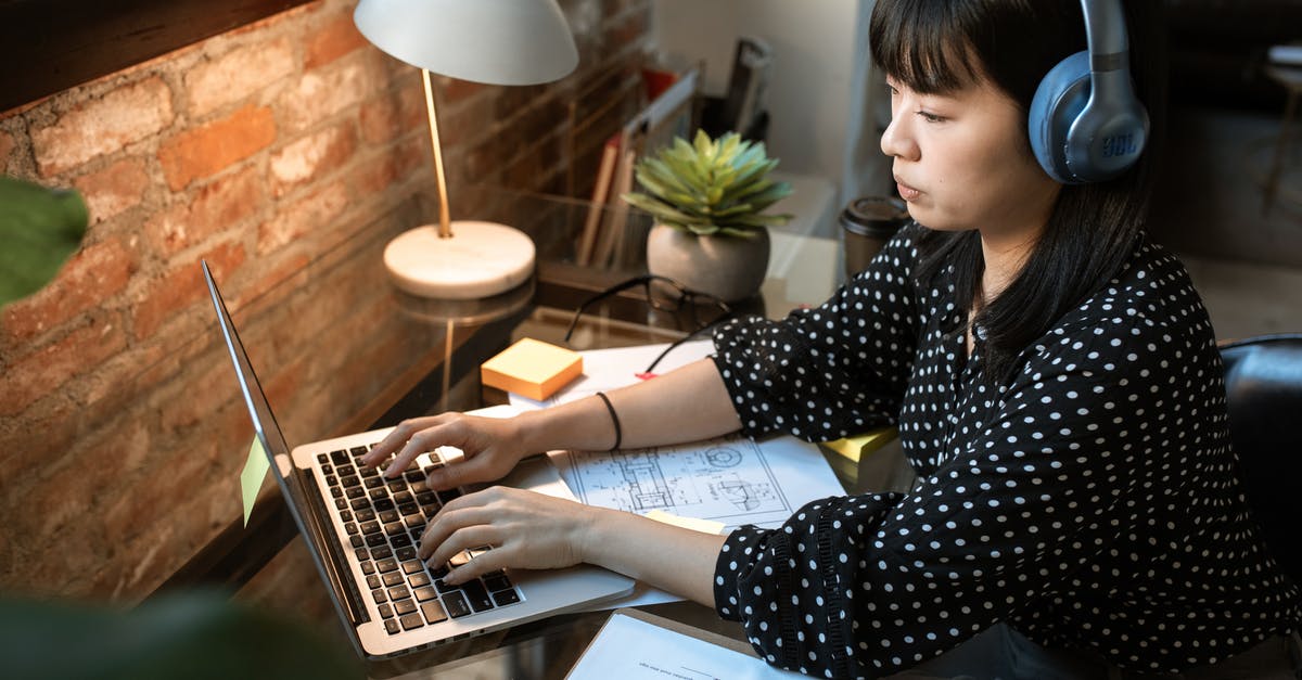 Job interview in London requires me to wire money to the travel agent. Is this a scam? - Woman in Black and White Polka Dot Long Sleeve Shirt Using Macbook Air Job interview in London requires me to wire money to the travel agent. Is this a scam? - Woman in Black and White Polka Dot Long Sleeve Shirt Using Macbook Air