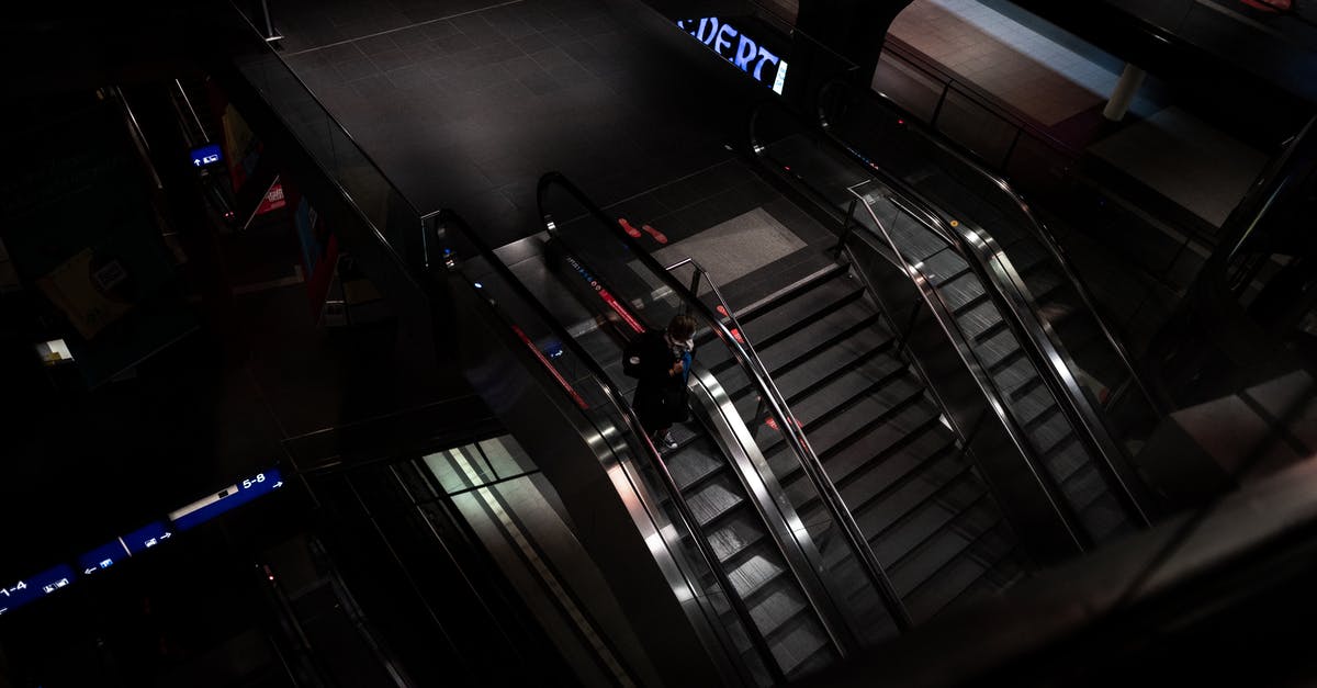 Jungfrau transport - Black and Gray Escalator Inside Building Jungfrau transport - Black and Gray Escalator Inside Building