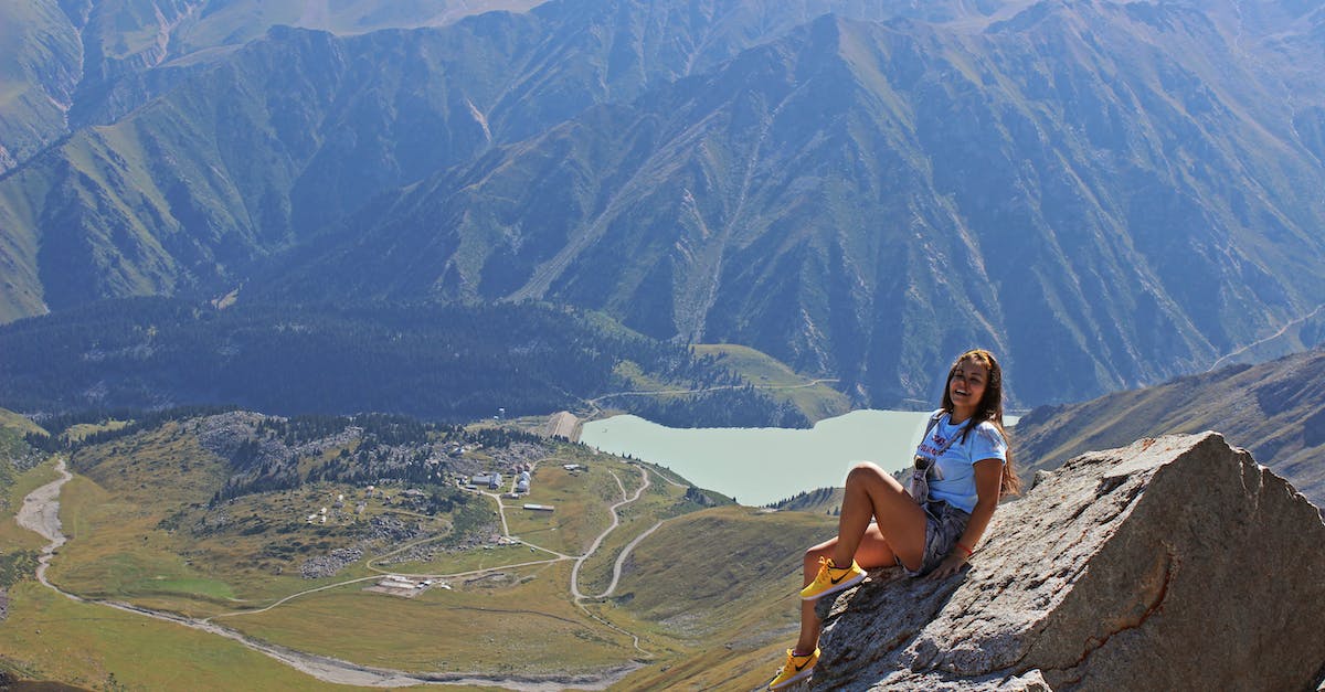Kazakhstan visa in Uzbekistan? - Woman Sitting on Gray Stone Kazakhstan visa in Uzbekistan? - Woman Sitting on Gray Stone