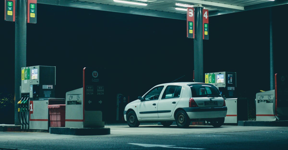 Keflavik car hire shuttle bus service timetable - White Suv on Gray Asphalt Road during Night Time Keflavik car hire shuttle bus service timetable - White Suv on Gray Asphalt Road during Night Time