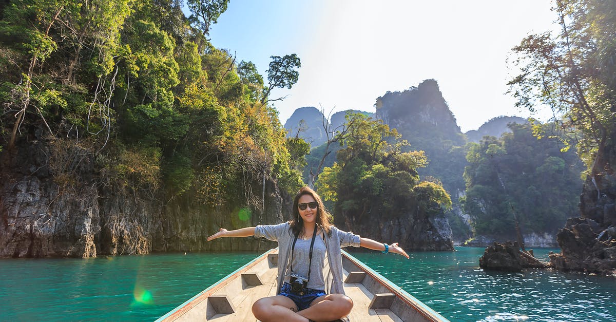 Korean Visa for a layover tour - Photo of Woman Sitting on Boat Spreading Her Arms Korean Visa for a layover tour - Photo of Woman Sitting on Boat Spreading Her Arms