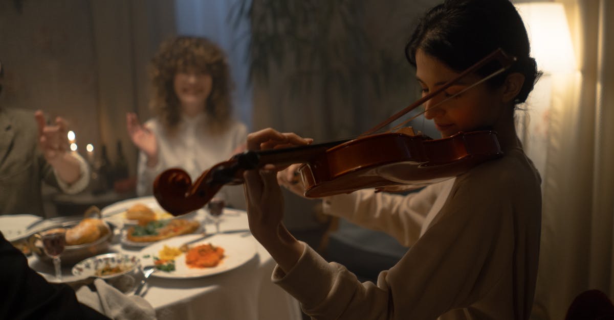 Kosher Food in Heathrow airport - Woman Playing Violin For Entertainment Kosher Food in Heathrow airport - Woman Playing Violin For Entertainment