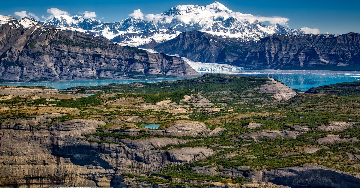 Kuwaiti Travelling to Alaska - Body of Water in Between Mountains Kuwaiti Travelling to Alaska - Body of Water in Between Mountains