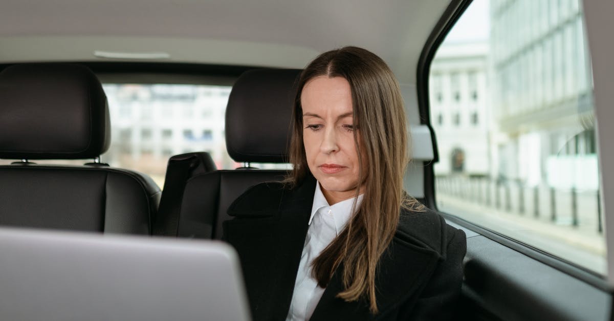 L/100 km or km/L? which one is used? I am planning travel in Mexico & Colombia by car [closed] - Woman in Black Blazer Sitting on Car Seat