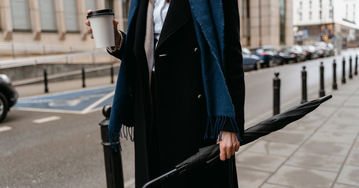 L/100 km or km/L? which one is used? I am planning travel in Mexico & Colombia by car [closed] - Woman in Blue Coat Holding White Cup