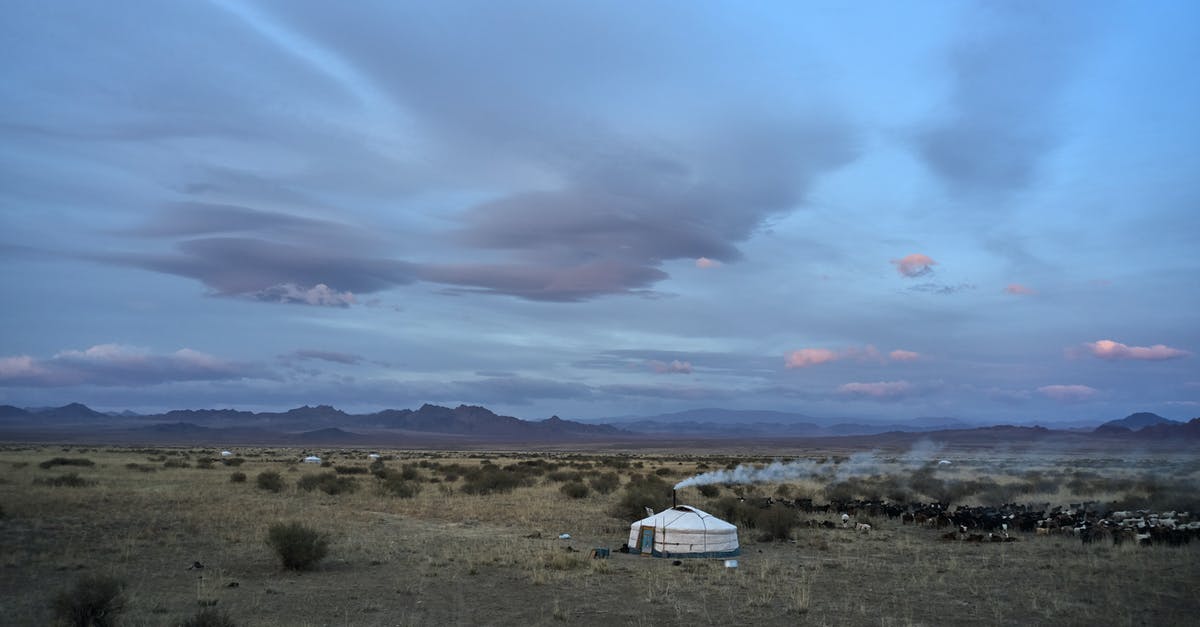 Land Rover in Mongolia with no hired driver - Yurt in spacious valley in summer evening Land Rover in Mongolia with no hired driver - Yurt in spacious valley in summer evening