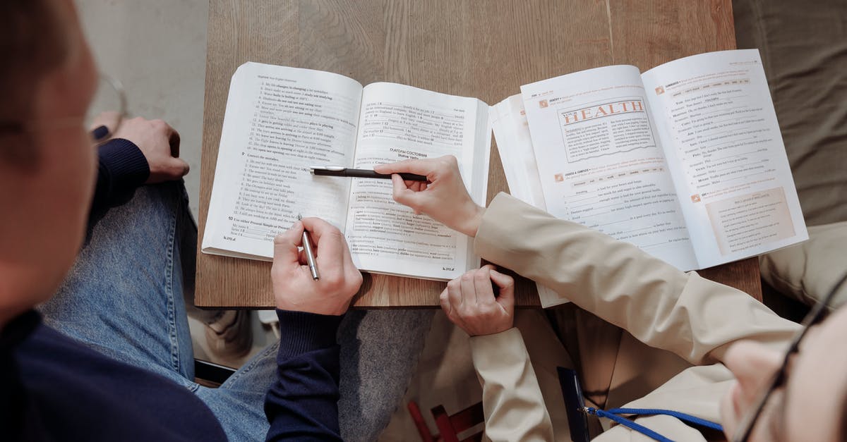Language schools that teach Mayan languages around Lake Atlitlan, Guatemala? - Person in Brown Coat Holding White Printer Paper Language schools that teach Mayan languages around Lake Atlitlan, Guatemala? - Person in Brown Coat Holding White Printer Paper