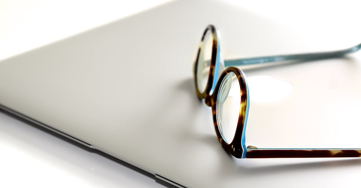 Laptop and tablet restrictions within US air travel - Black and Blue Framed Eyeglasses on Silver Laptop Laptop and tablet restrictions within US air travel - Black and Blue Framed Eyeglasses on Silver Laptop