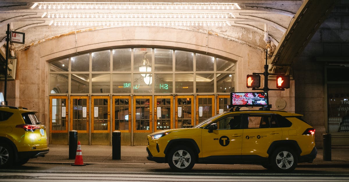 Late night taxis at the Rosslyn (Virginia) Station - Stylish yellow SUV cab parked on road in evening Late night taxis at the Rosslyn (Virginia) Station - Stylish yellow SUV cab parked on road in evening