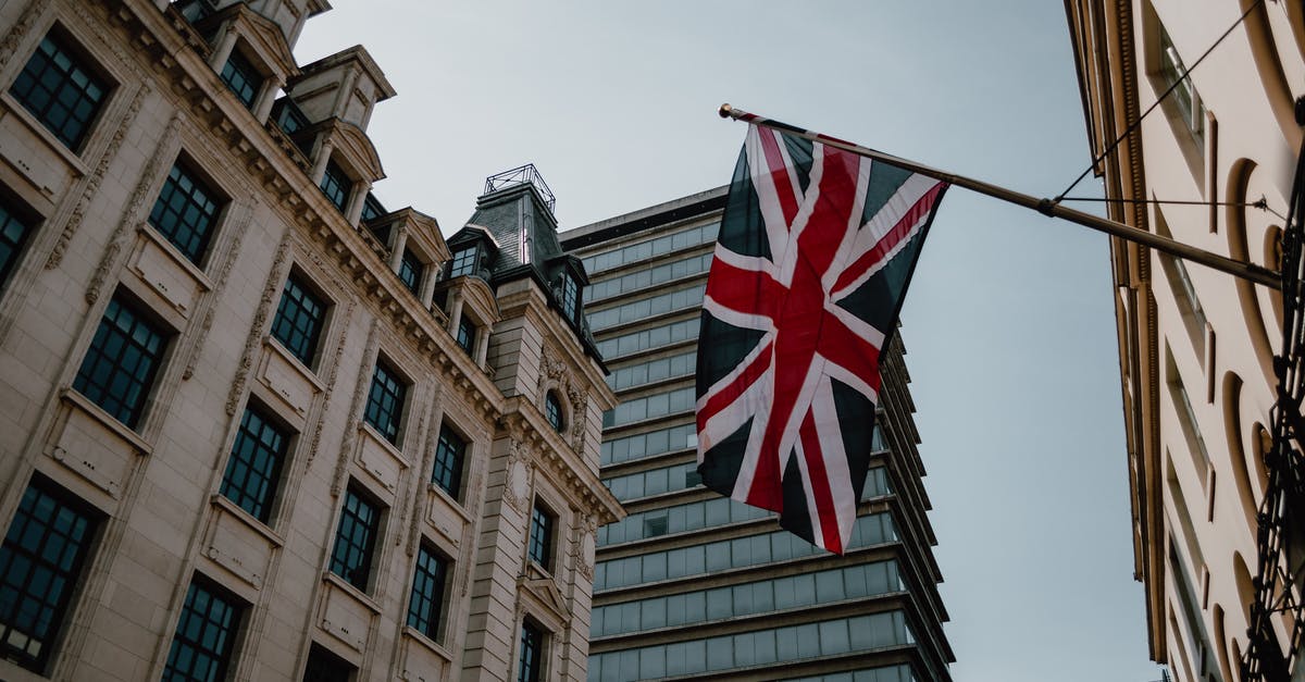 Layover at London Heathrow [duplicate] - Us a Flag on Brown Concrete Building