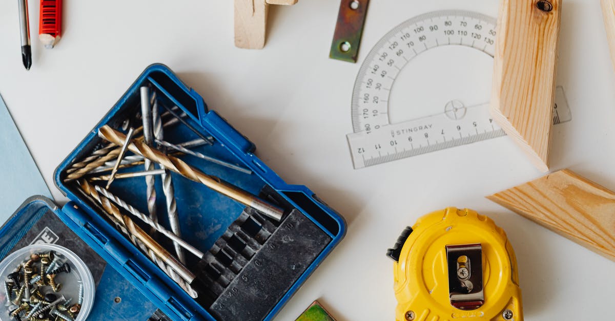 “Overstaying” for a bit? - Close-Up Photo of a Measuring Tape Near a Protractor “Overstaying” for a bit? - Close-Up Photo of a Measuring Tape Near a Protractor