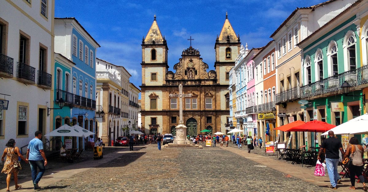 Leaving USA to go to Brazil. Also have Irish Passport which doesn't need a visa for Brazil [duplicate] - Historical center of city in sunlight