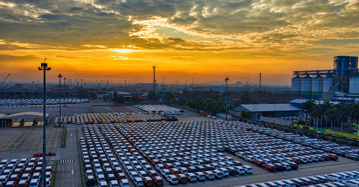 Legality of parking helpers (tukang parkir) in Indonesia - An Aerial Photography of Cars Parked Under the Cloudy Sky Legality of parking helpers (tukang parkir) in Indonesia - An Aerial Photography of Cars Parked Under the Cloudy Sky
