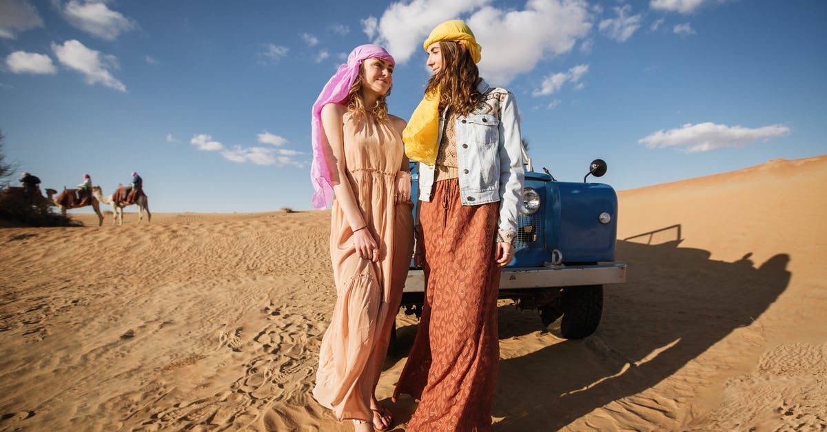 Leisure/single long-visit visa Dubai - Women in Long Dresses Standing Near Blue Vehicle Leisure/single long-visit visa Dubai - Women in Long Dresses Standing Near Blue Vehicle