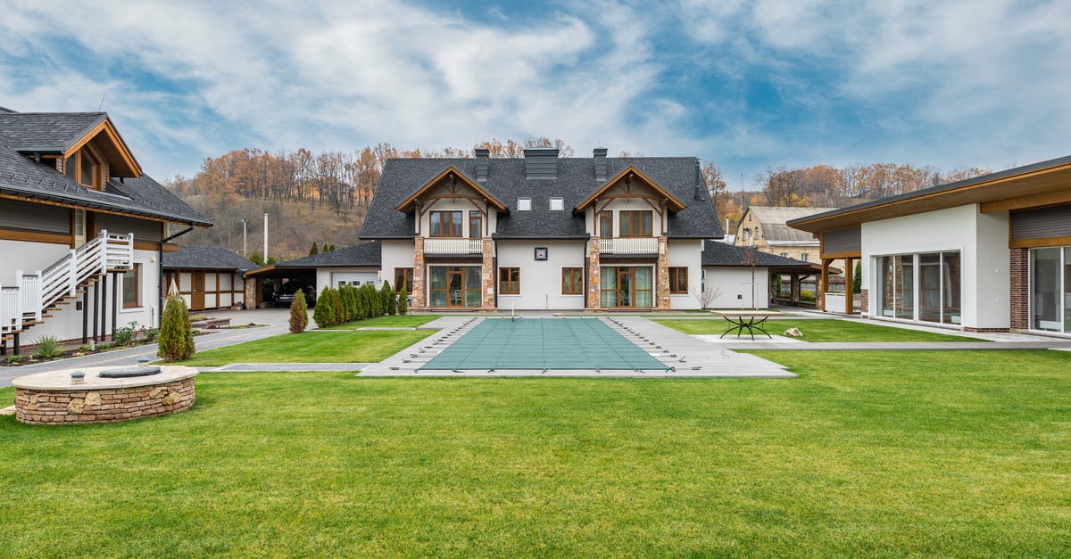 Location of Terme di Nikà - Pantelleria - Exterior of contemporary residential cottage house with green lawn in yard under cloudy sky Location of Terme di Nikà - Pantelleria - Exterior of contemporary residential cottage house with green lawn in yard under cloudy sky