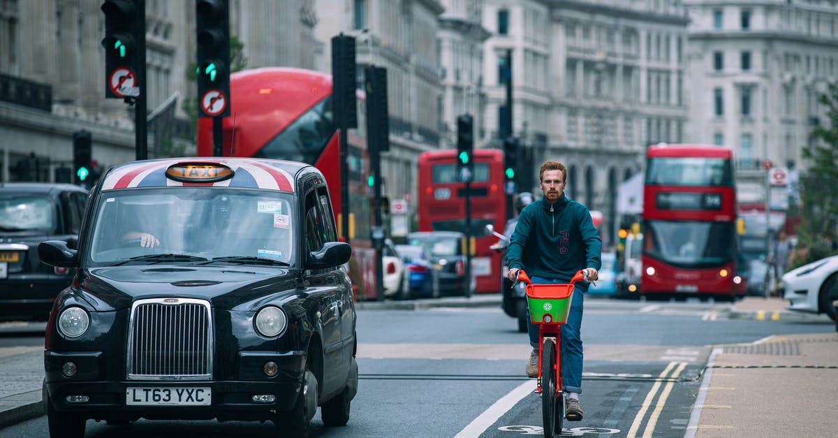 London cycle hire without chip-and-pin - Man in Green Jacket Riding Bicycle on Road London cycle hire without chip-and-pin - Man in Green Jacket Riding Bicycle on Road