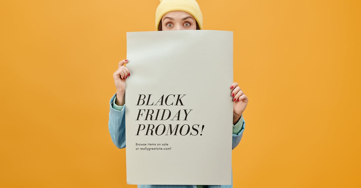 London Tube: Buying paper tickets at Gatwick? - Woman in Blue Long Sleeve Shirt Holding White Poster London Tube: Buying paper tickets at Gatwick? - Woman in Blue Long Sleeve Shirt Holding White Poster