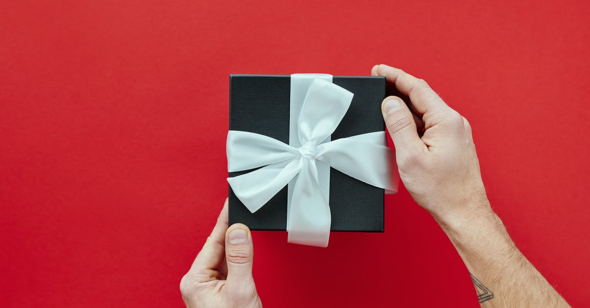London Tube: Buying paper tickets at Gatwick? - Black Gift Box With White Ribbon London Tube: Buying paper tickets at Gatwick? - Black Gift Box With White Ribbon