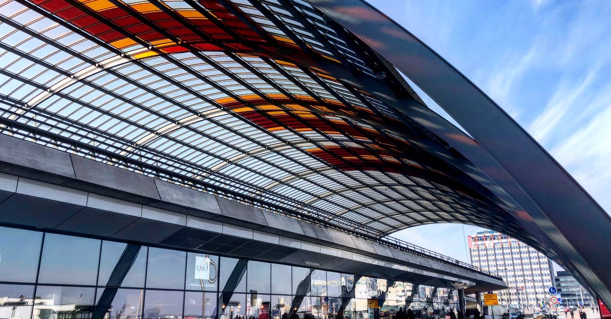Long layover in Amsterdam airport - Amsterdam Central Station Under Color Stained Glass Roof Long layover in Amsterdam airport - Amsterdam Central Station Under Color Stained Glass Roof