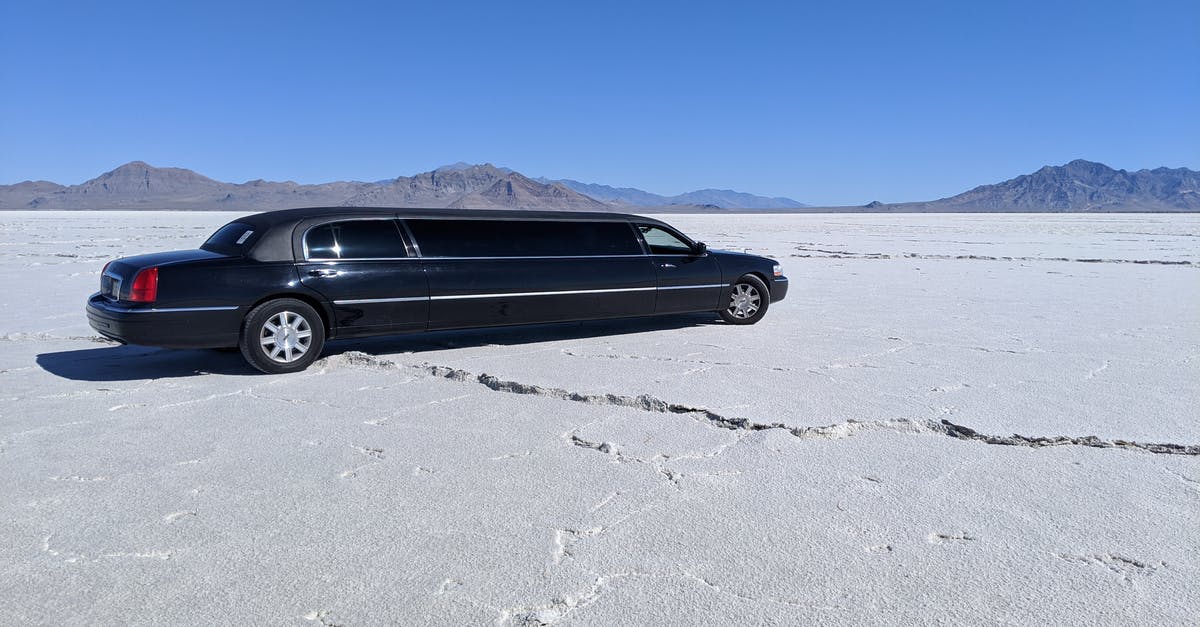 Long Layover in Korea - Black Sedan on Gray Sand Long Layover in Korea - Black Sedan on Gray Sand