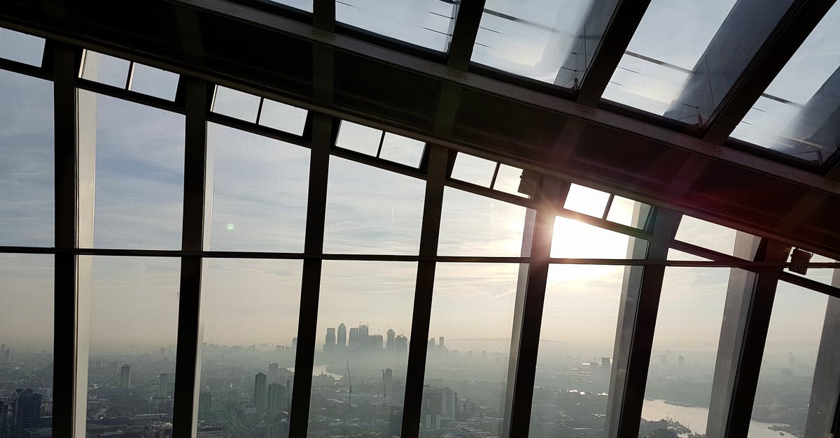 Long layover in London with change in airport - Clear Glass Window Lot during Golden Hour Long layover in London with change in airport - Clear Glass Window Lot during Golden Hour