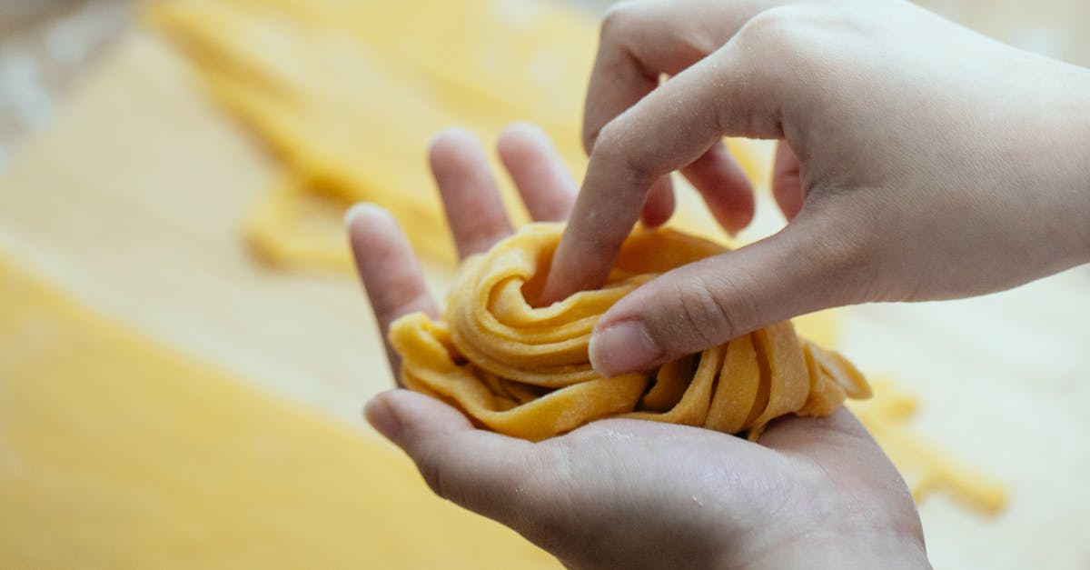 Long term Italian visa for Malaysian citizens - Woman making homemade pasta with egg dough Long term Italian visa for Malaysian citizens - Woman making homemade pasta with egg dough