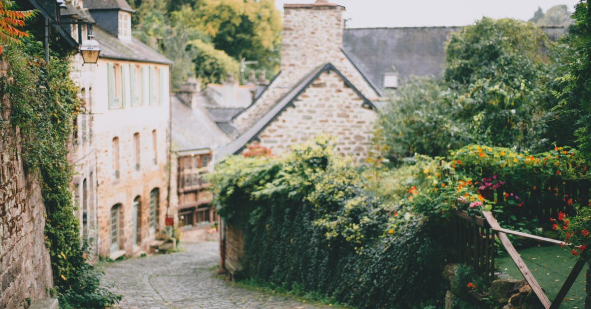 Long walking trails in Europe with accommodation enroute - Picturesque scenery of stone houses surrounded with lush trees Long walking trails in Europe with accommodation enroute - Picturesque scenery of stone houses surrounded with lush trees