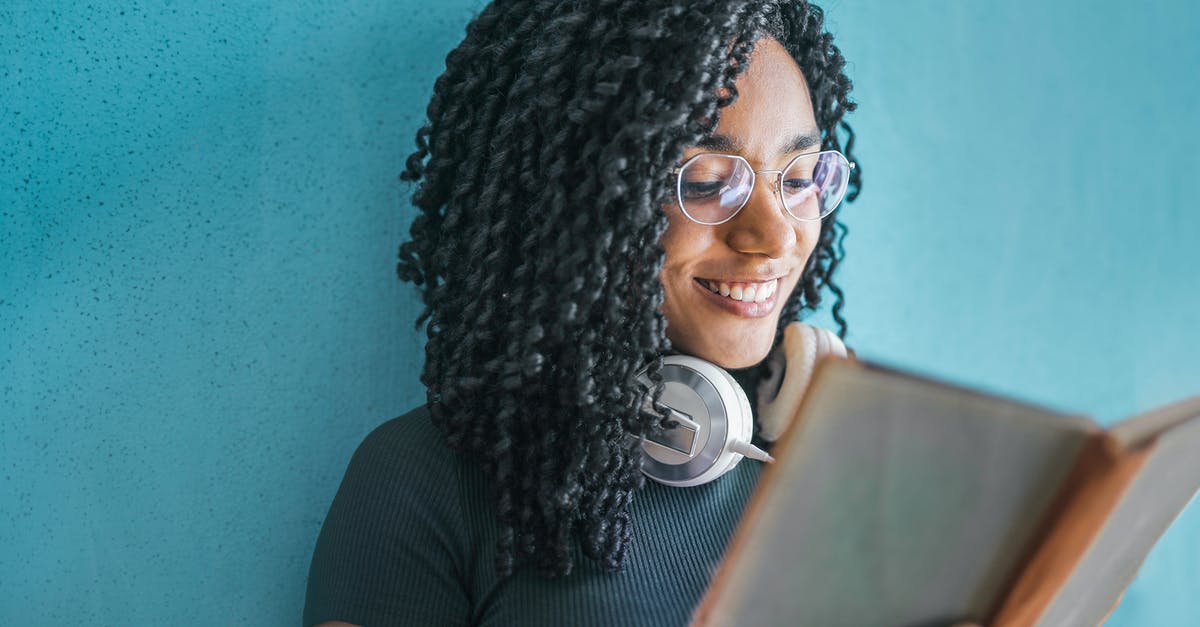 Looking for a book on hiking trails in USA written by an African American woman [closed] - Woman in Black Shirt Wearing White Headphones