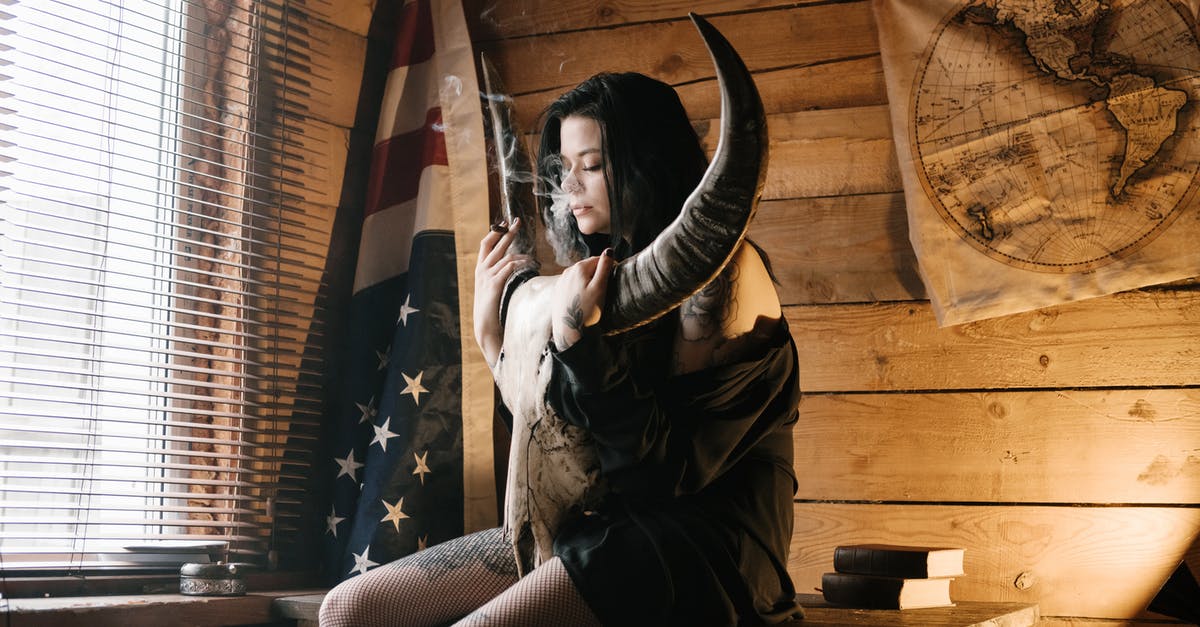 Looking for a book on hiking trails in USA written by an African American woman [closed] - Young modern lady smoking with horned animal skull in hands