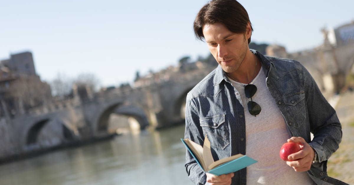 Looking for a two-level bridge somewhere near Xanthi, Greece - Woman in Blue Denim Jacket Holding Book Near Body of Water Looking for a two-level bridge somewhere near Xanthi, Greece - Woman in Blue Denim Jacket Holding Book Near Body of Water