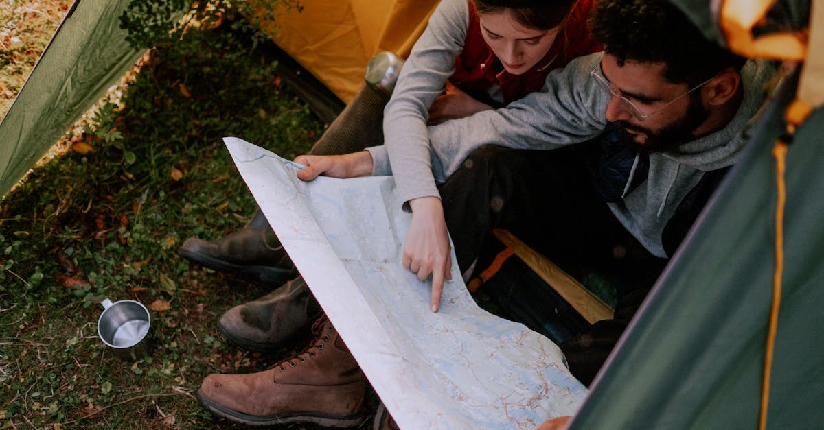 Looking for a very last minute adventure trip (5th -13th May) [closed] - Couple Looking at a Map Together