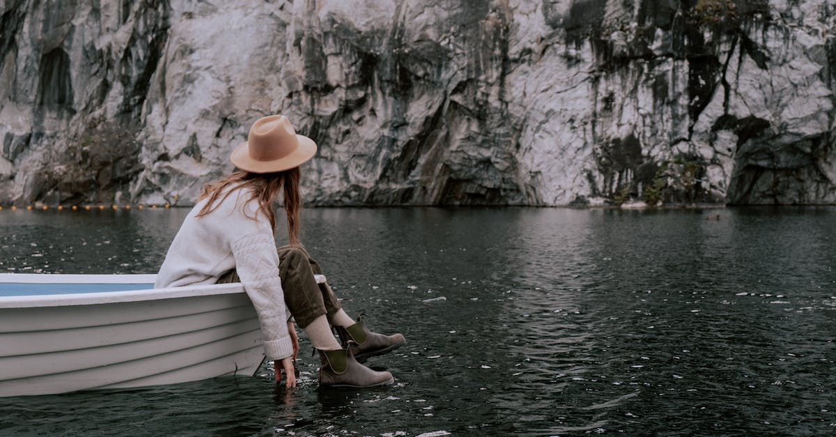 Looking for a very last minute adventure trip (5th -13th May) [closed] - A Woman Sitting on the Boat while Looking at the Rock Formation