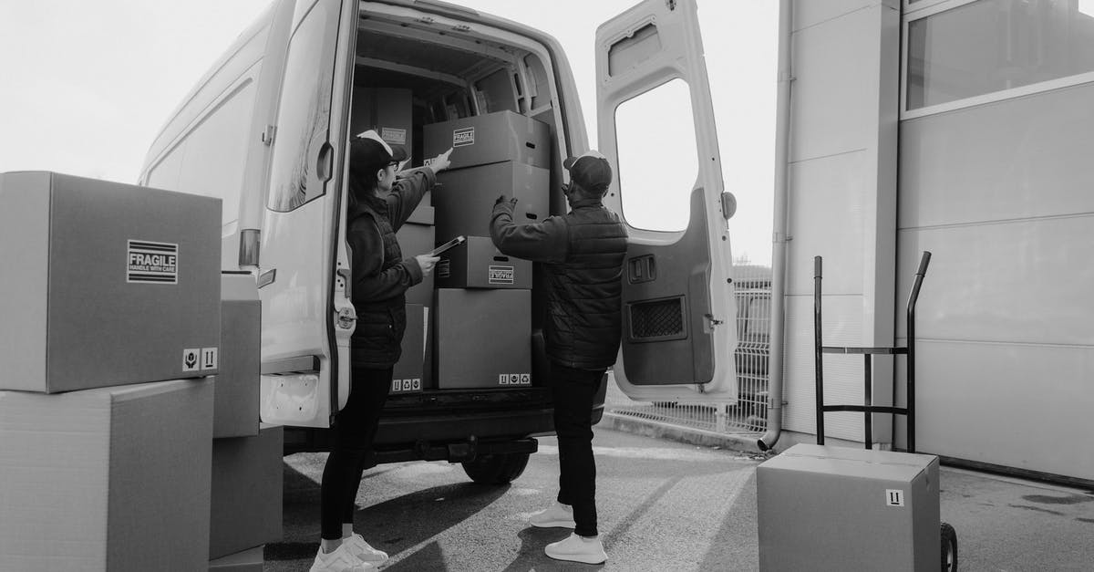 Luggage storage at El Alto La Paz airport - Man in Black Jacket and Pants Standing in Front of Man in Black Jacket in Grayscale Luggage storage at El Alto La Paz airport - Man in Black Jacket and Pants Standing in Front of Man in Black Jacket in Grayscale
