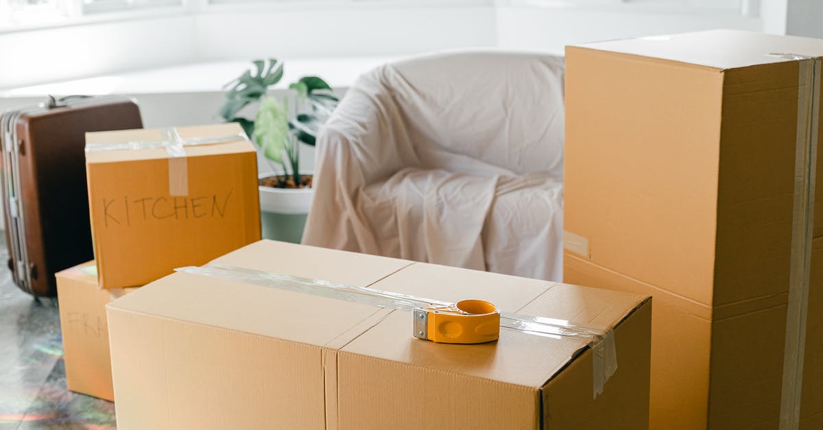 Luggage storage in Boston - Empty apartment with packed carton boxes before moving Luggage storage in Boston - Empty apartment with packed carton boxes before moving
