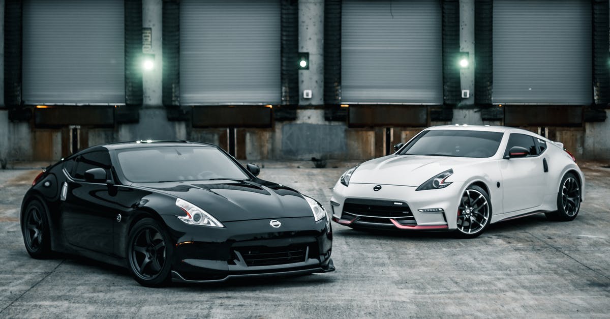 Machine readable zone missing from Vietnam visa. Is this going to be a problem? - Shiny new coupe cars parked near warehouse