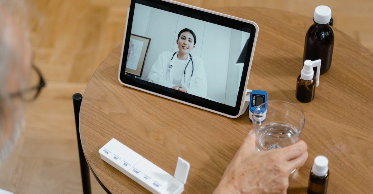 Making calls from Romania - High-Angle Shot of a Person Making a Zoom Call to a Doctor Making calls from Romania - High-Angle Shot of a Person Making a Zoom Call to a Doctor