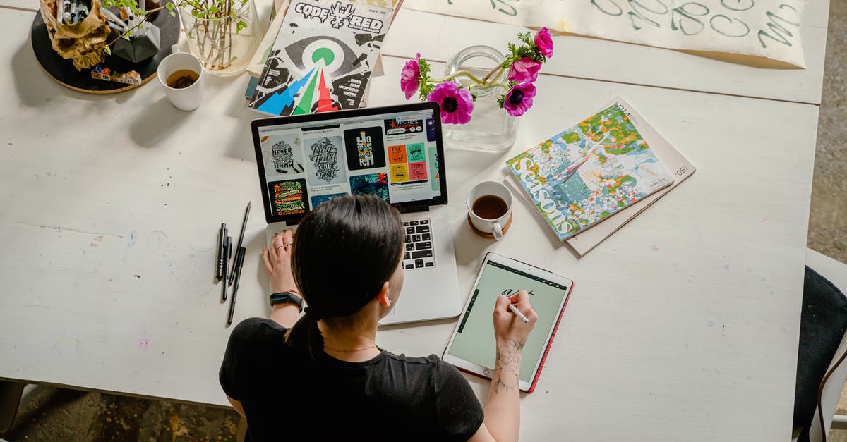 Making pen and ink corrections on a UK visa form? - Photo of Woman Writing on Tablet Computer While Using Laptop Making pen and ink corrections on a UK visa form? - Photo of Woman Writing on Tablet Computer While Using Laptop