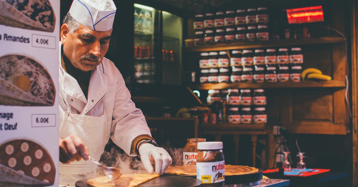 Making Restaurant Reservations in Paris from America - Person Cooking Inside Kitchen Making Restaurant Reservations in Paris from America - Person Cooking Inside Kitchen