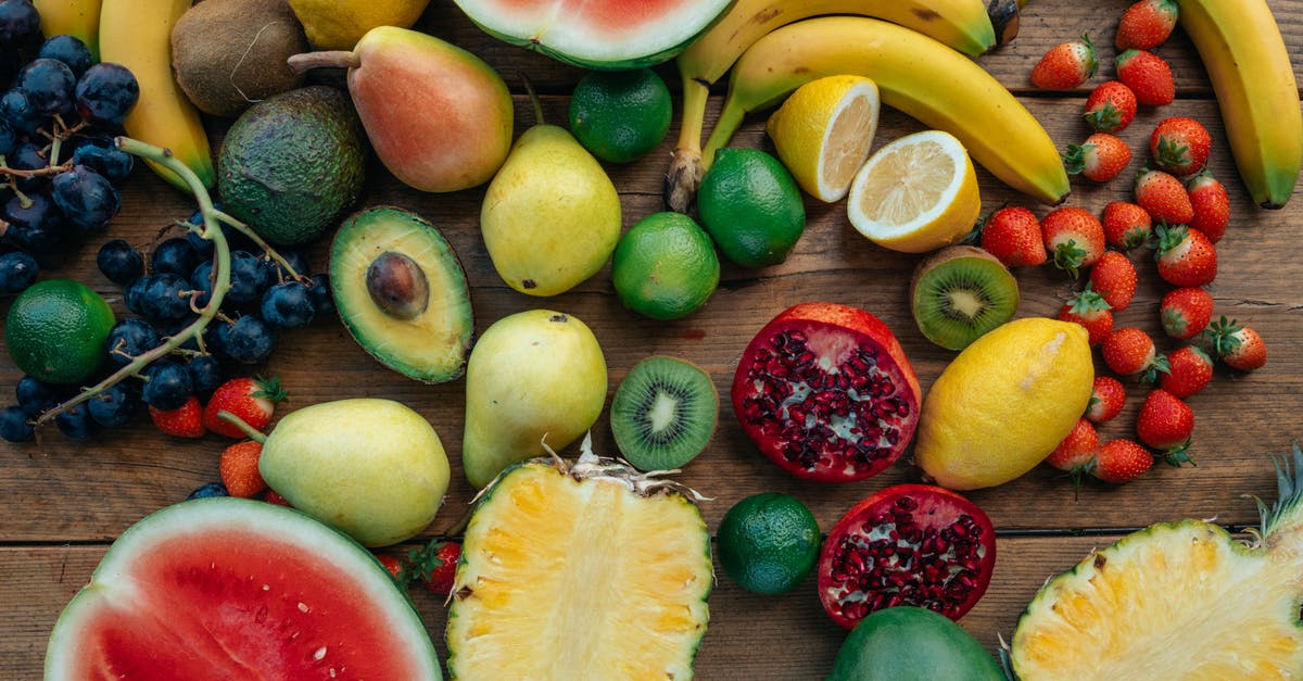 Mangoes and Bananas from Manila to Switzerland - Assorted Fruits on Wooden Surface Mangoes and Bananas from Manila to Switzerland - Assorted Fruits on Wooden Surface