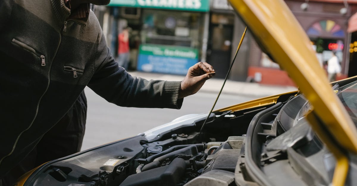 Manual or Automatic transmission: Do rental companies let you choose which type of car you want to rent? - Ethnic mechanic changing detail in car engine