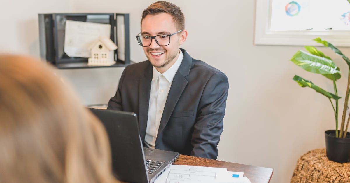 Massive price difference between broker and rental car company - A Broker Smiling Behind His Office Desk Massive price difference between broker and rental car company - A Broker Smiling Behind His Office Desk