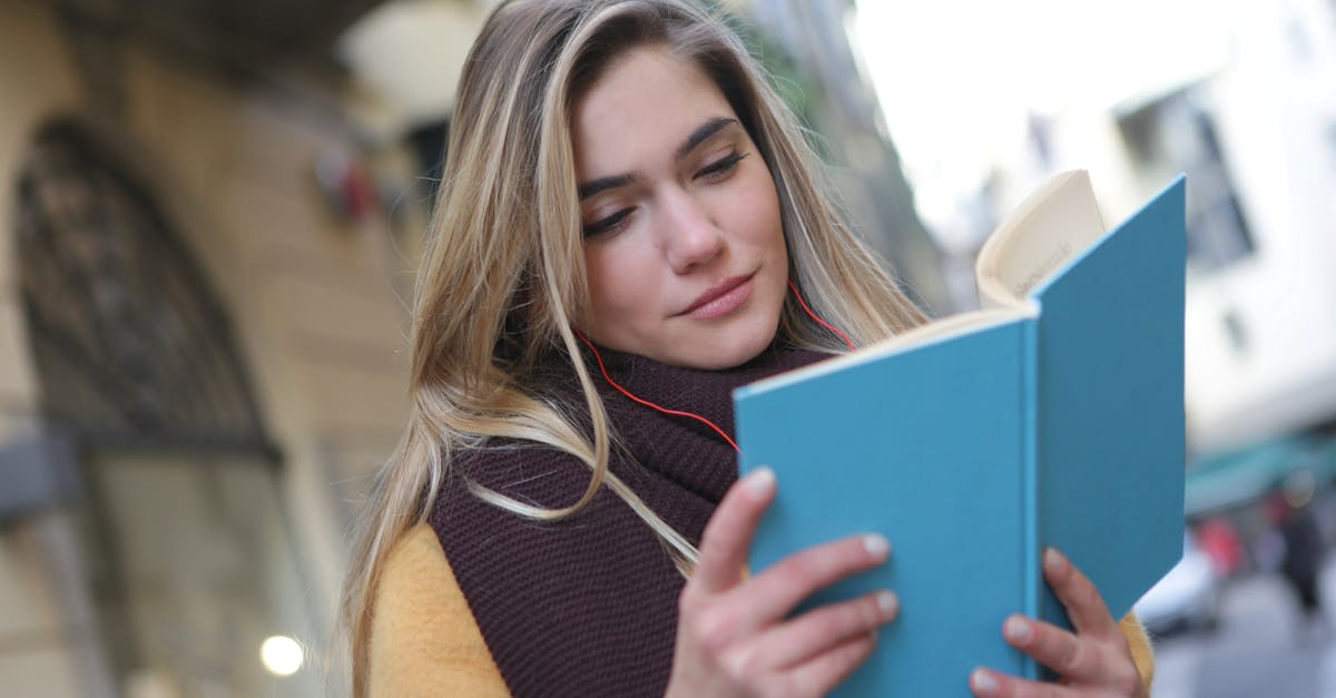 Master’s in France by holding a student tier 4 visa in Uk [closed] - Woman in Purple Scarf Reading A Book