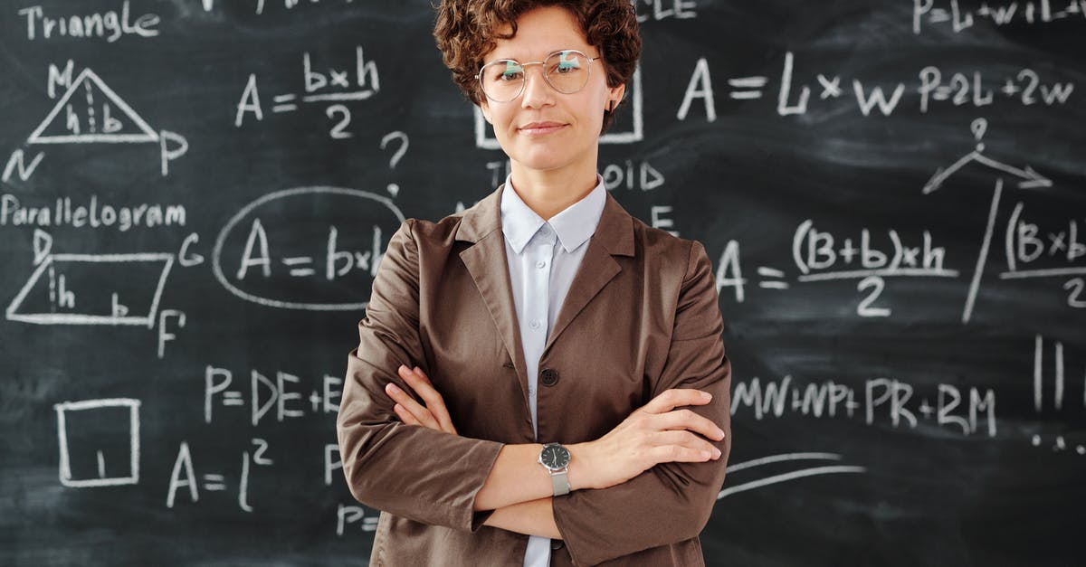 Maximum Number of Occupants crossing US/Canada Border - Photo Of Woman Standing In Front Of Blackboard Maximum Number of Occupants crossing US/Canada Border - Photo Of Woman Standing In Front Of Blackboard